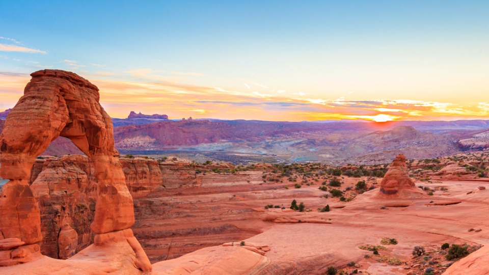 The sun sets in Arches National Park