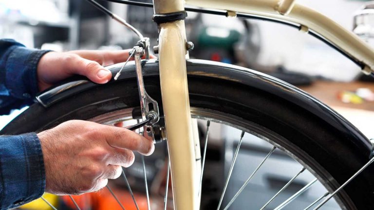 Adjusting a bike's brakes as part of regular maintenance